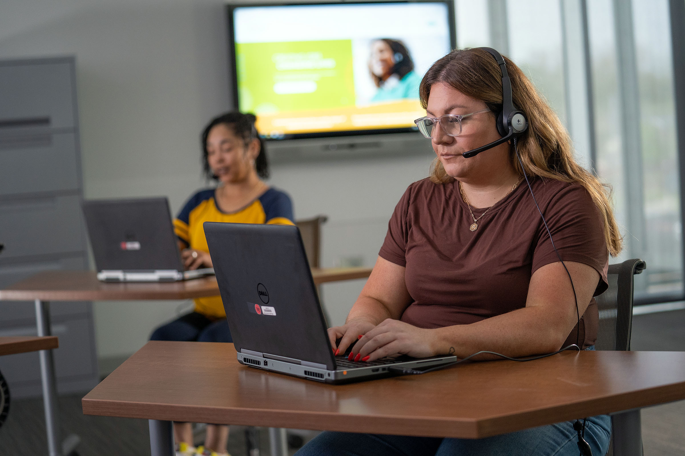 Medical Transcription Editor Working on Laptop