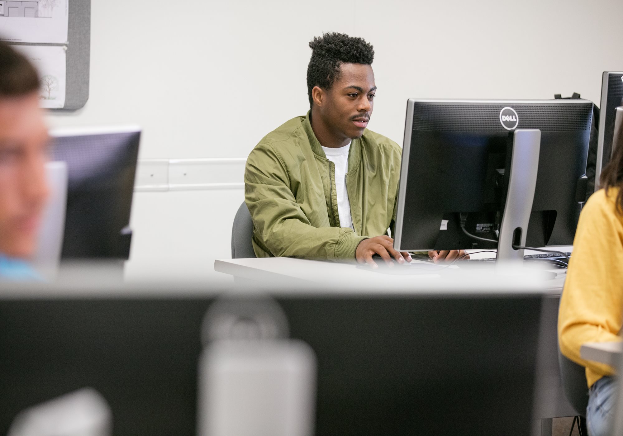 Male Student Looking at Monitor