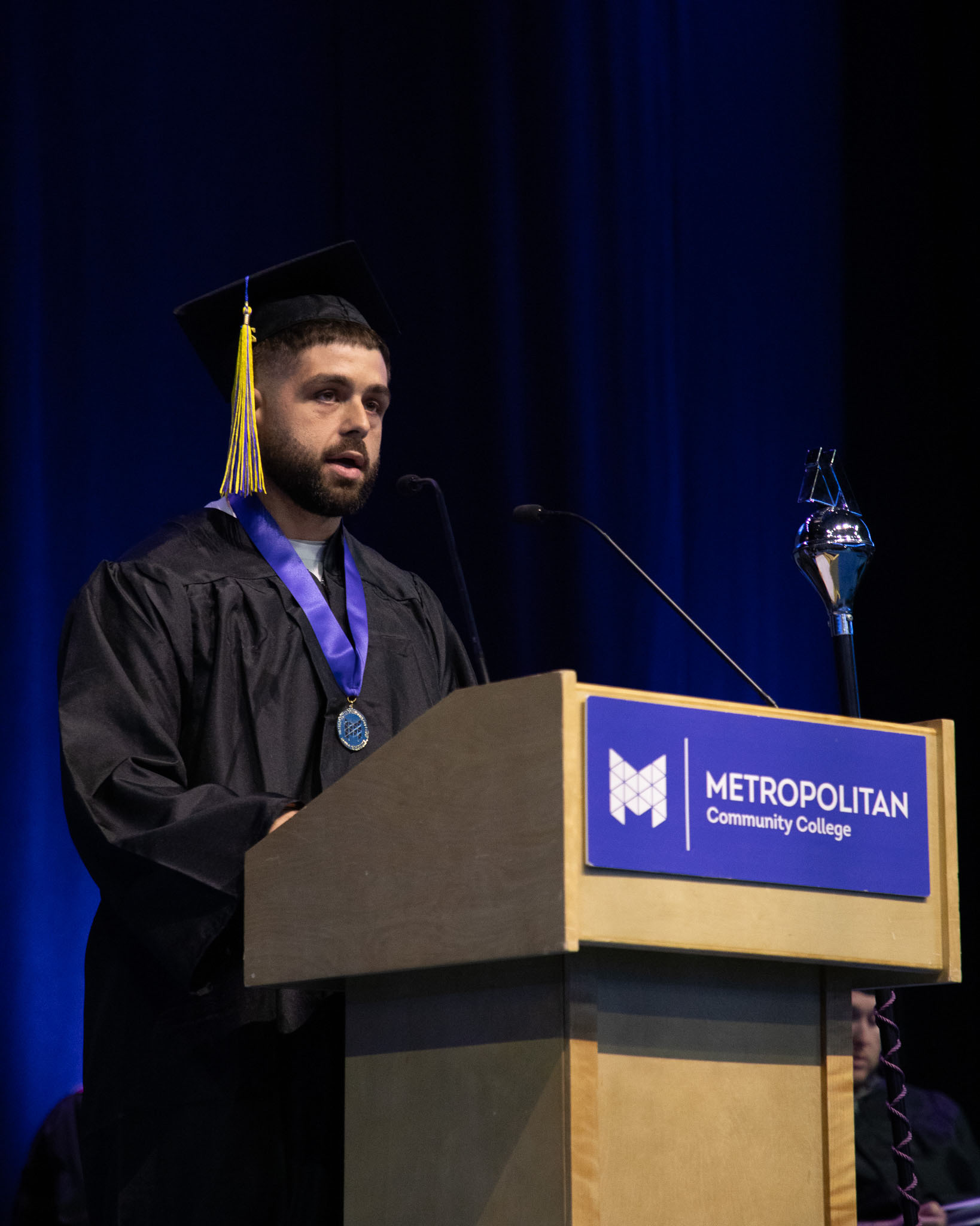 Student speaker giving speech on stage