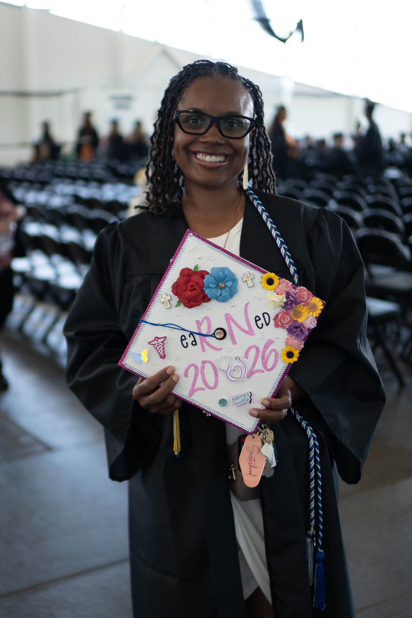 Female graduate showing cap decoration
