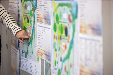 Women pointing at map